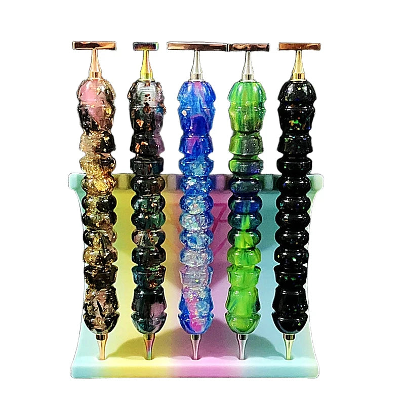 A set of colorful diamond painting pens with stainless steel tips displayed in a light blue tray.