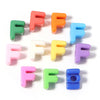 A collection of colorful acrylic letter F alphabet beads arranged in a semi-circle.