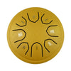 A round, golden steel tongue drum with numbered holes and mallets.
