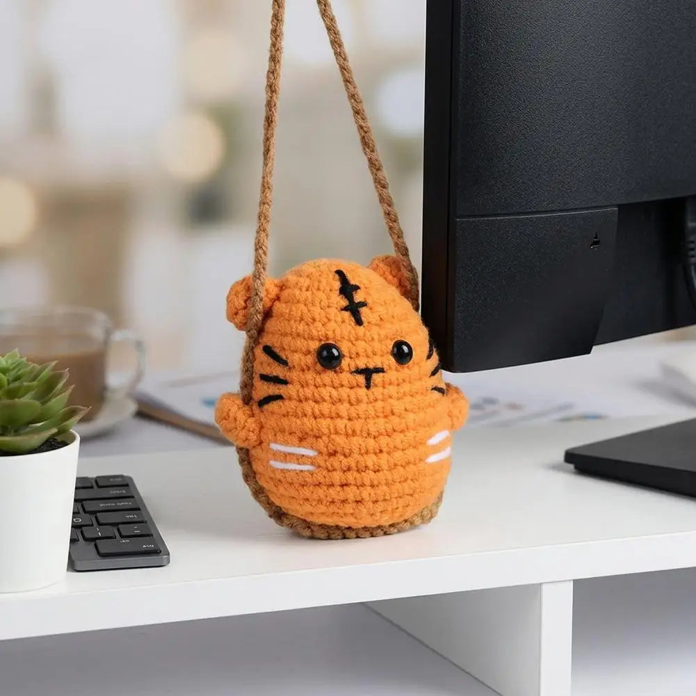 Hand-crocheted orange tiger frog mirror hanging ornament with a brown leather cord