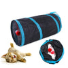 Black foldable S-shaped cat tunnel with blue trim and hanging red ball toys