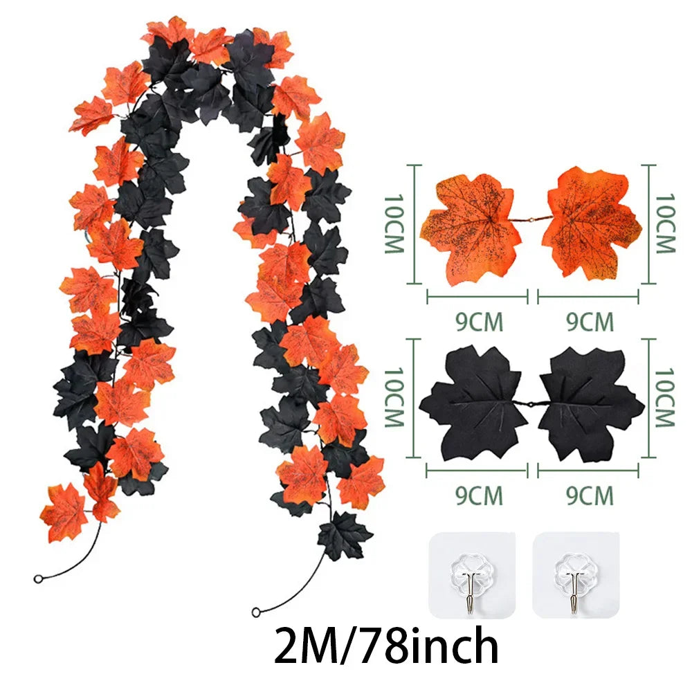Artificial fall maple leaf garland in orange and black for autumn decor