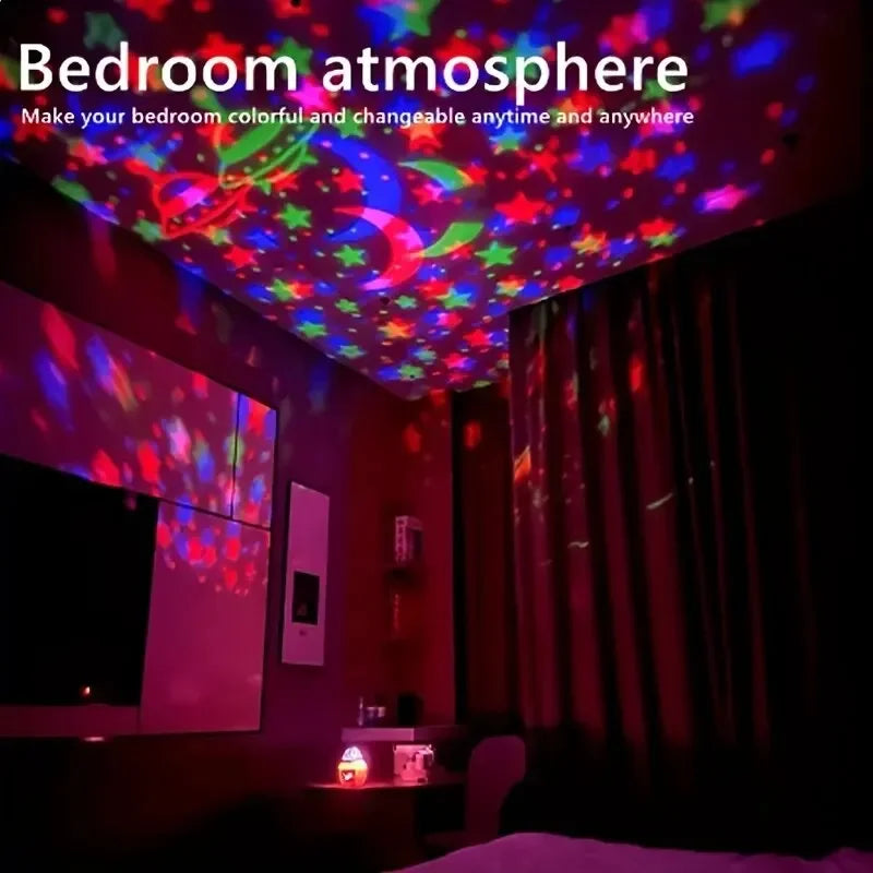 A bedroom is illuminated by a projector displaying colorful moon and star effects on the ceiling.