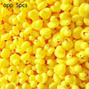 A pile of yellow squeaky floating duck bath toys made of soft silicone.
