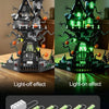 A spooky Halloween castle kit built from dark gray and black blocks, showing both light-off and light-on effects.