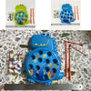A blue magnetic fishing toy set for kids featuring a fish and various colorful magnetic pieces on a surface with a ruler.