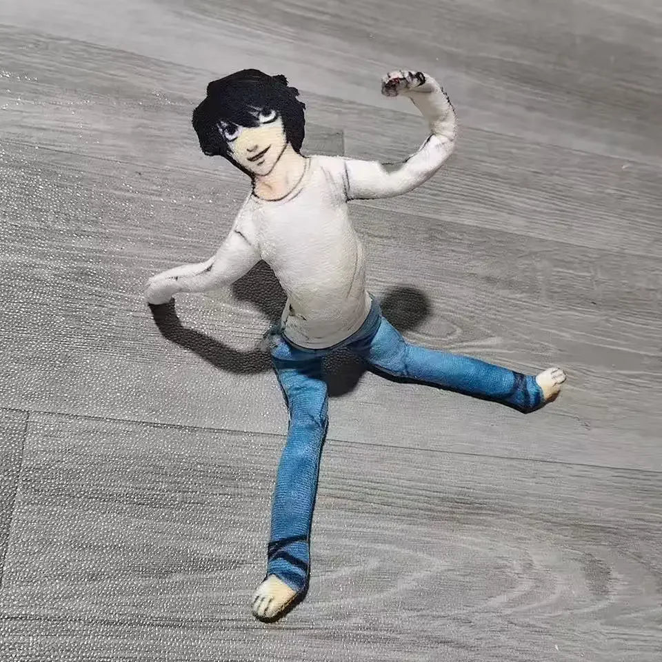 A poseable plush doll resembling L Lawliet from Death Note, dressed in a white shirt and blue jeans.