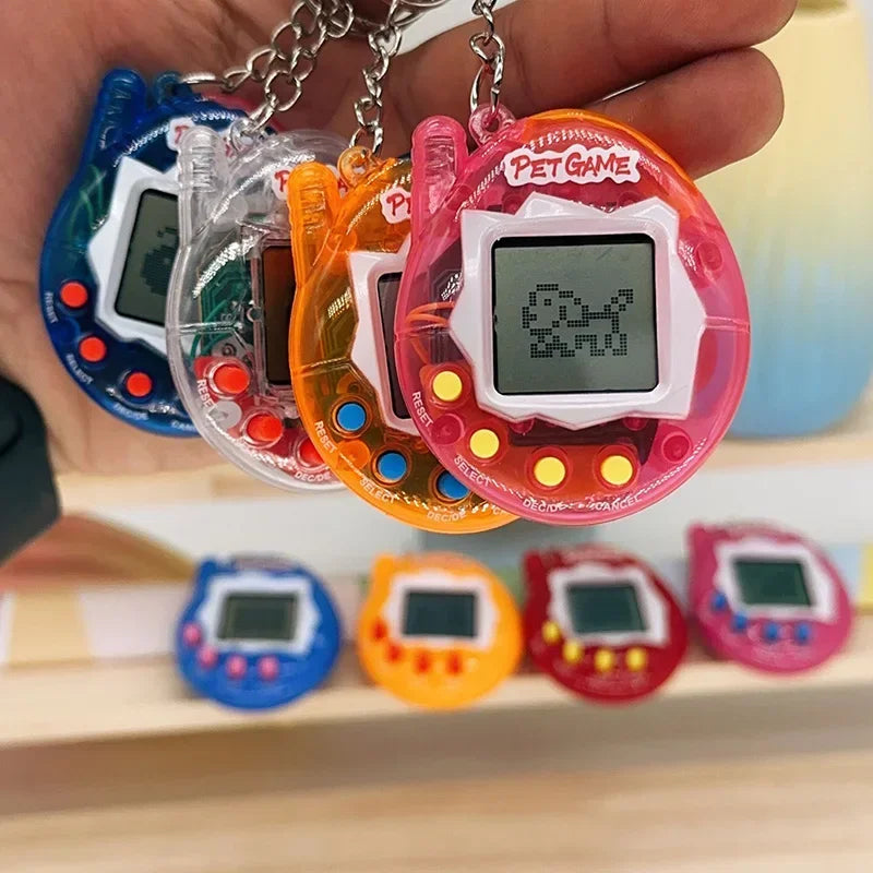 A hand holds several bright colored interactive virtual pet toys with digital screens and chains.