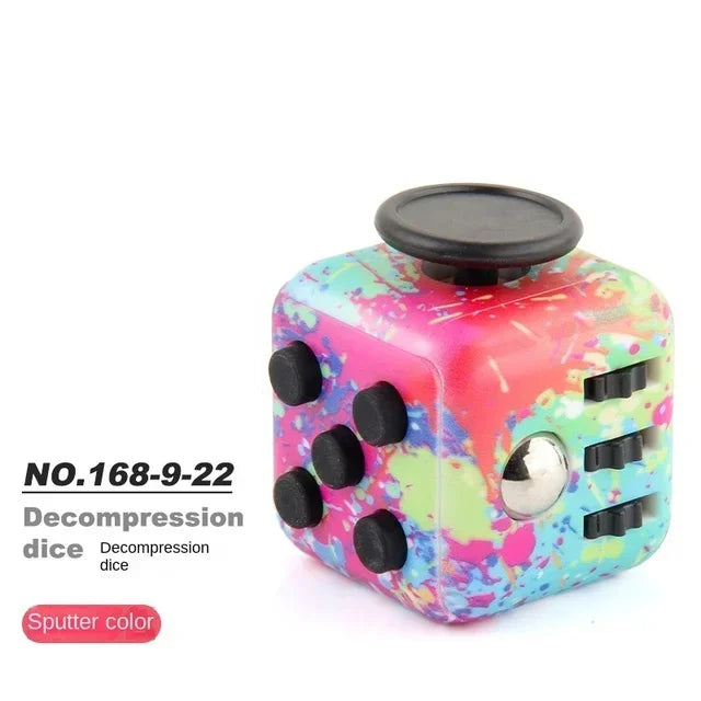 A colorful fidget cube with a pink and green marbled design and a black top.