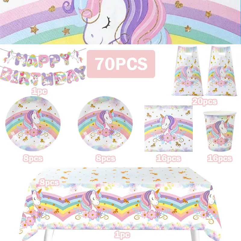 A collection of unicorn party supplies including decorations, tableware, and a tablecloth for a birthday celebration.