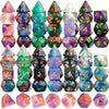 A collection of seven premium glitter polyhedral dice in various colors and patterns.