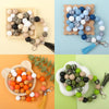 A collection of printed silicone beads in leopard and daisy patterns for jewelry making, displayed on wooden trays.