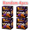 A set of four Halloween mystery squishy stress relief toys in purple and orange packaging.