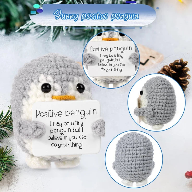 Handmade crochet penguin doll with a positive message card featuring the text I may be a tiny penguin but I believe in you go
