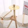 A wooden kids drum set with two drums and a mallet displayed on a light-colored surface.