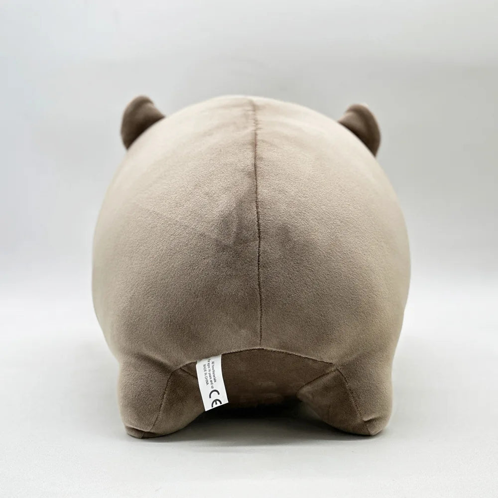 A beige Moo Deng Pygmy Hippo plush toy with small ears, shown from the back.