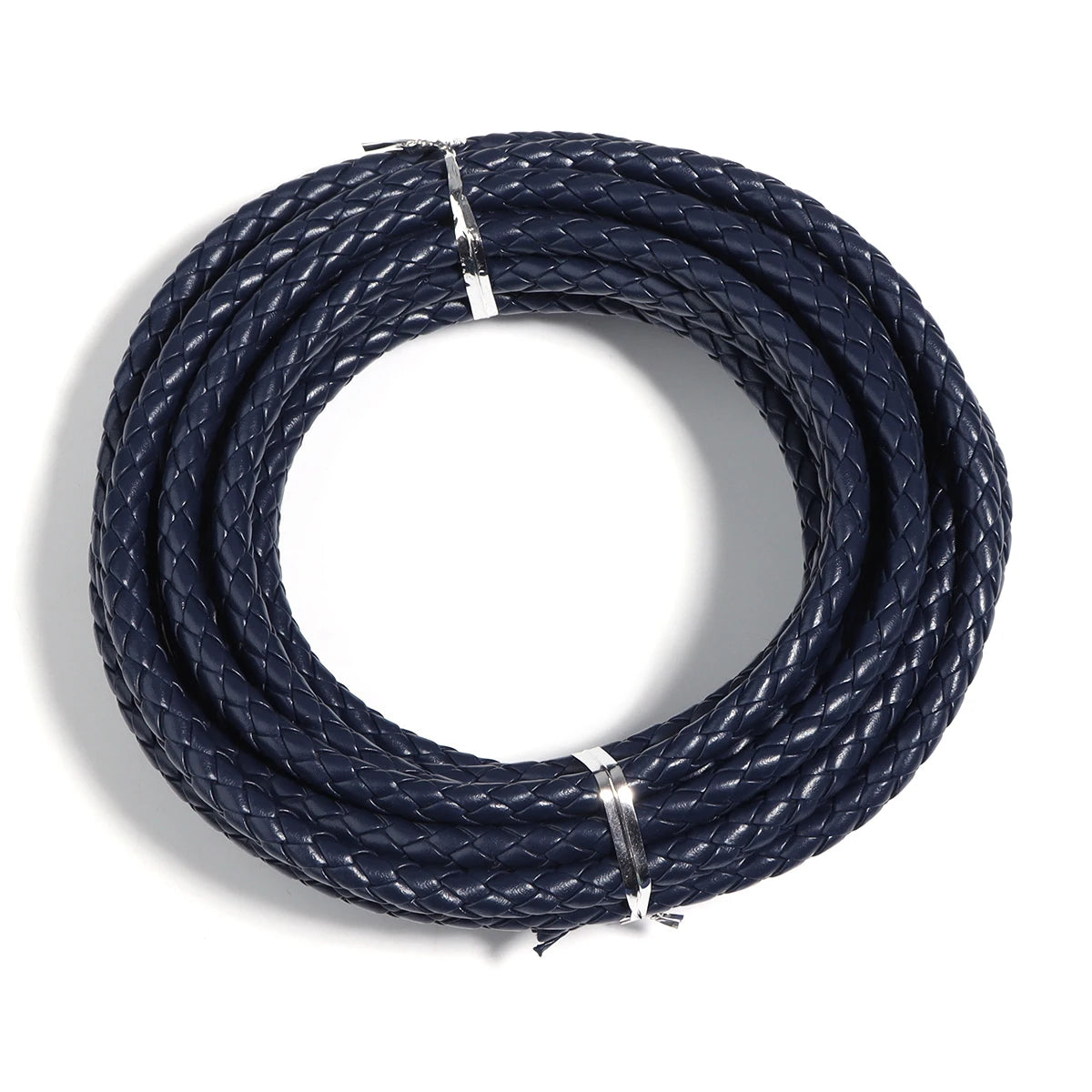 A coil of dark blue braided leather cord used for jewelry making and DIY crafts.