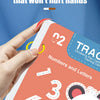 A hand holds a colorful practice book for children's pen control training featuring numbers and letters.