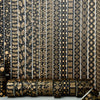 Rolls of black and gold foil washi tape set featuring intricate floral and geometric patterns