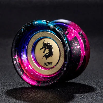 A close-up of a professional aluminum alloy yo-yo with high-speed ball bearing, featuring iridescent purple and pink colors.