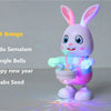 A pink musical robot rabbit toy with glowing eyes and light effects, set against a light gray background.