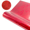 A close-up of red glitter holographic heat transfer vinyl material, showing its texture and sheen.
