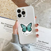 A white smartphone is held by a hand, featuring a black butterfly graphic that reads therapy is cool.