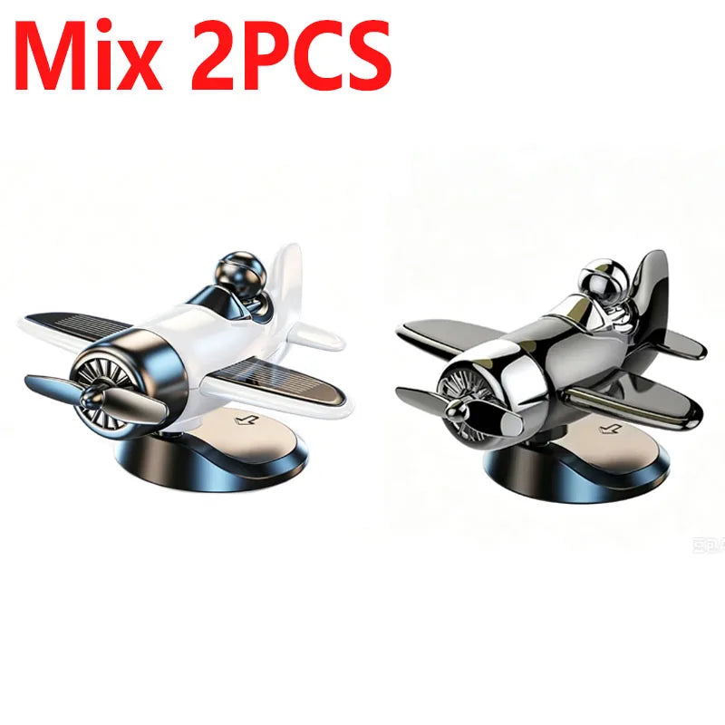 Two solar powered rotating airplane dashboard ornaments shown side by side.