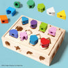 A wooden box with 22 holes used for matching various colored and shaped wooden blocks.
