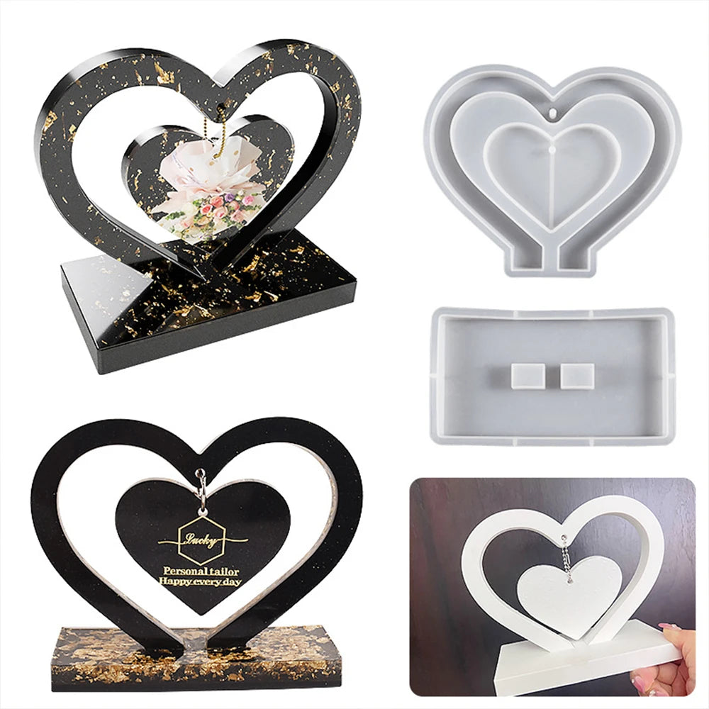 A set of heart-shaped silicone molds for resin casting, including a decorative frame and flat molds.