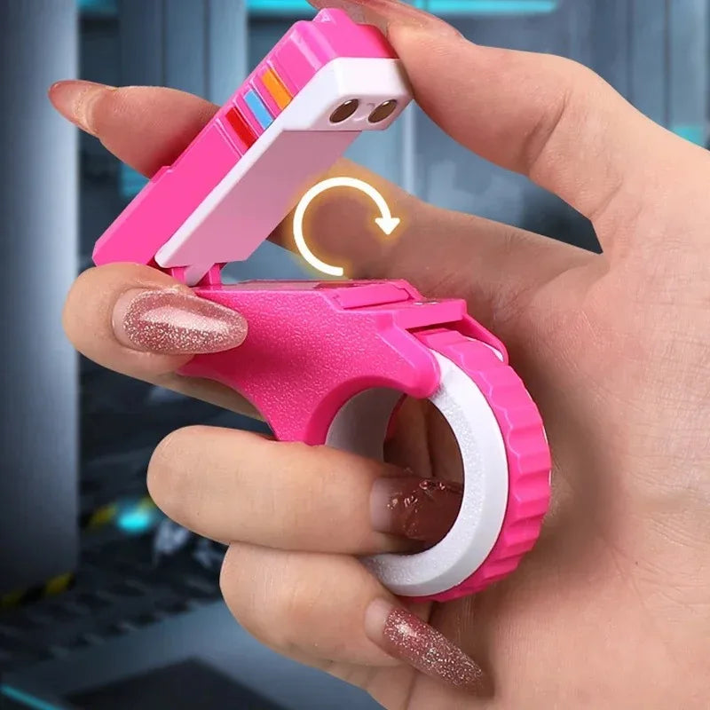 A hand holds a pink magnetic fidget push card with a spinner for stress relief.