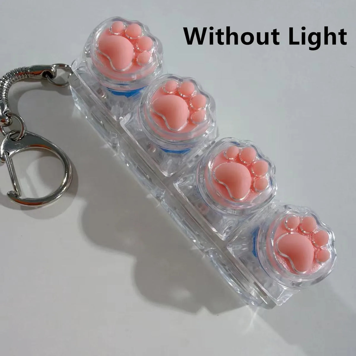 Clear acrylic keychain featuring four pink clicky key buttons for fidget use without light