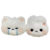 A pair of white plush rabbit keychain charms with blue tear accents.