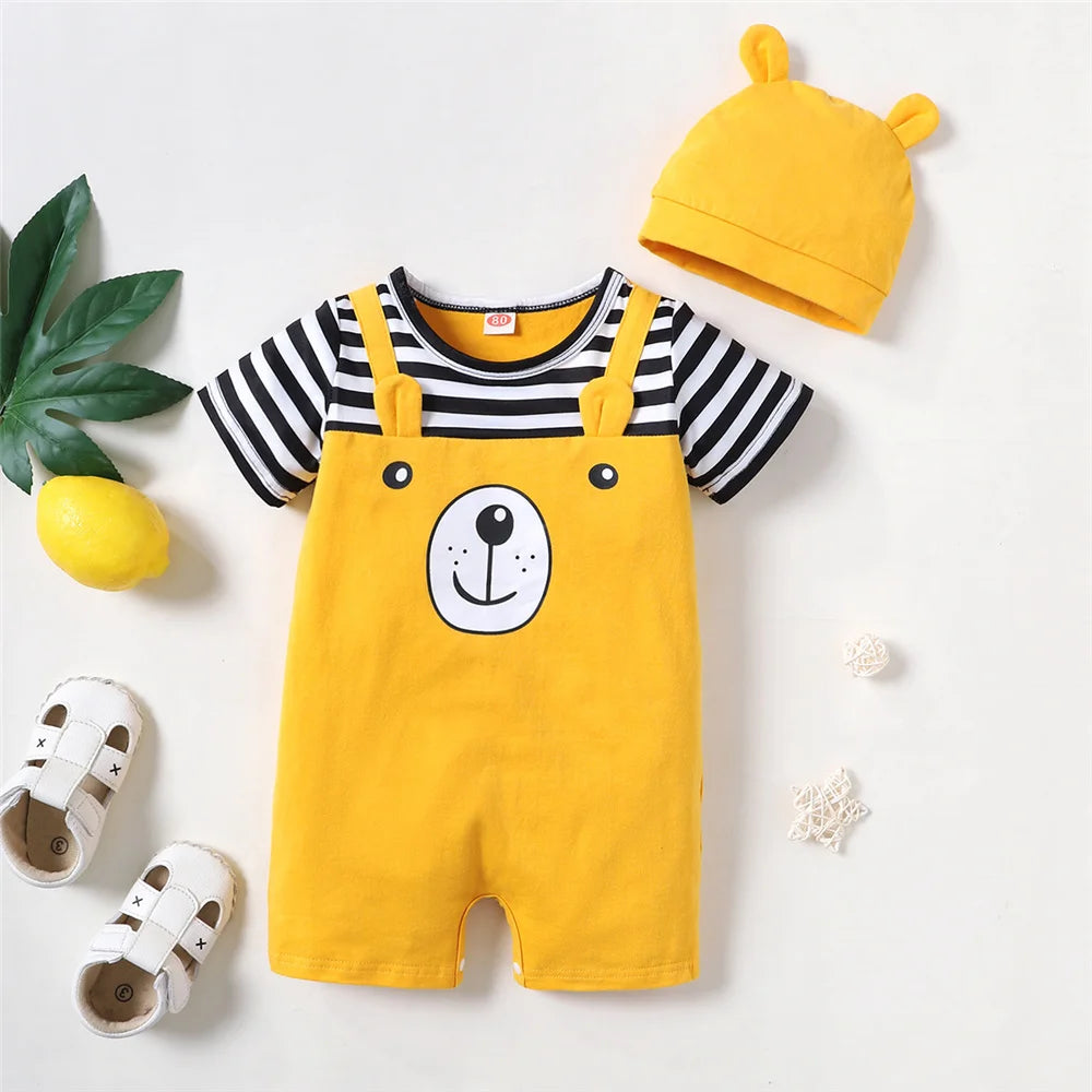 A yellow baby romper and matching hat featuring a bear face print, laid on a white surface.