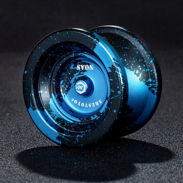 A close-up of a blue and black aluminum alloy yo-yo with a transparent sphere, showing the branding NOAS and A01.