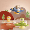 A set of three suction cup spinner bath toys for babies featuring a bear, a monkey, and a green animal.