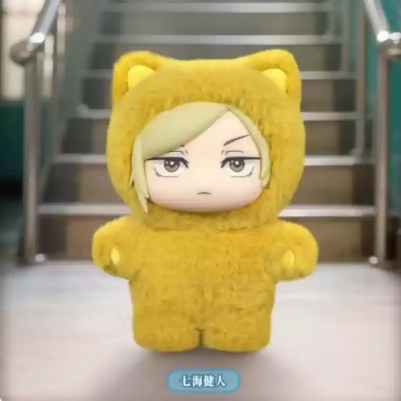 A yellow cat-eared plush toy with a blindfold design is shown in a close-up shot.