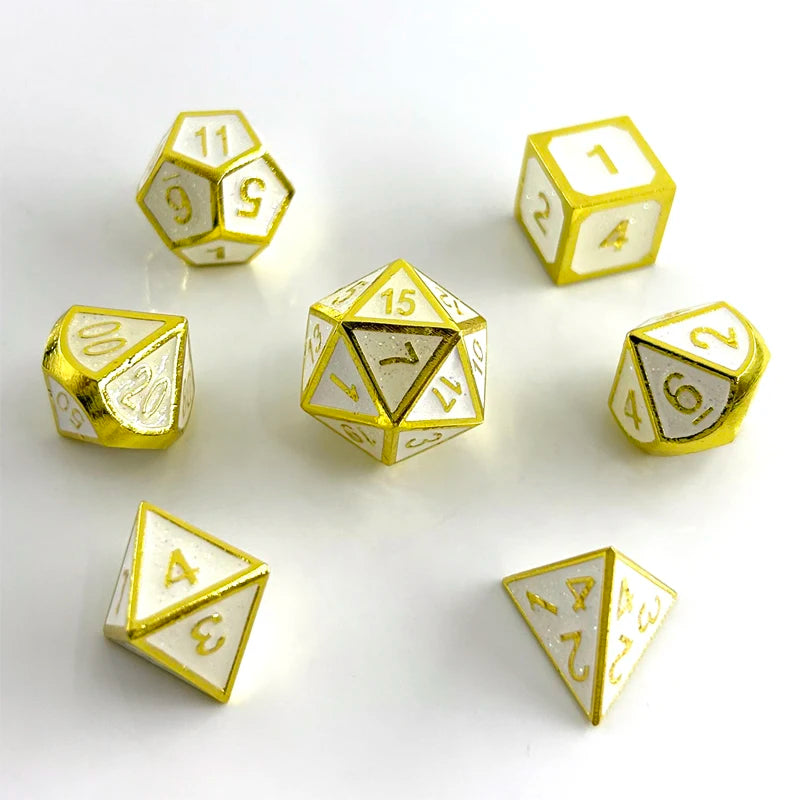 A set of polyhedral dice in a gold finish, showing various shapes and numbers on a white surface.