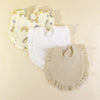 A set of three pure cotton muslin baby bibs featuring yellow and white fabric with rainbow designs.