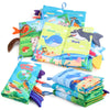 A collection of soft fabric baby books featuring animals like birds, whales, and sharks with tails and sound pages.