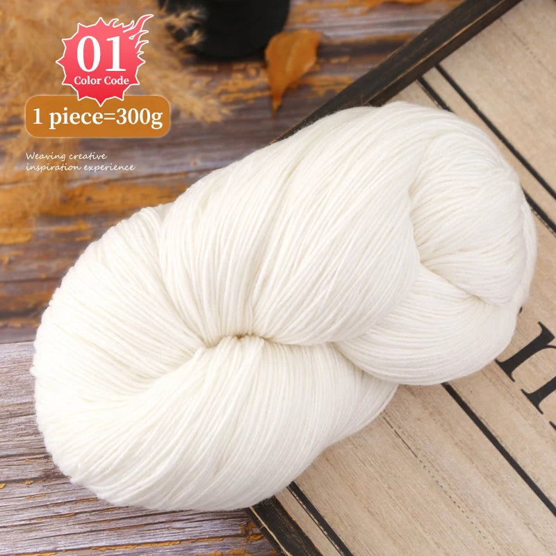 A ball of white premium alpaca blend yarn is shown on a wooden surface.