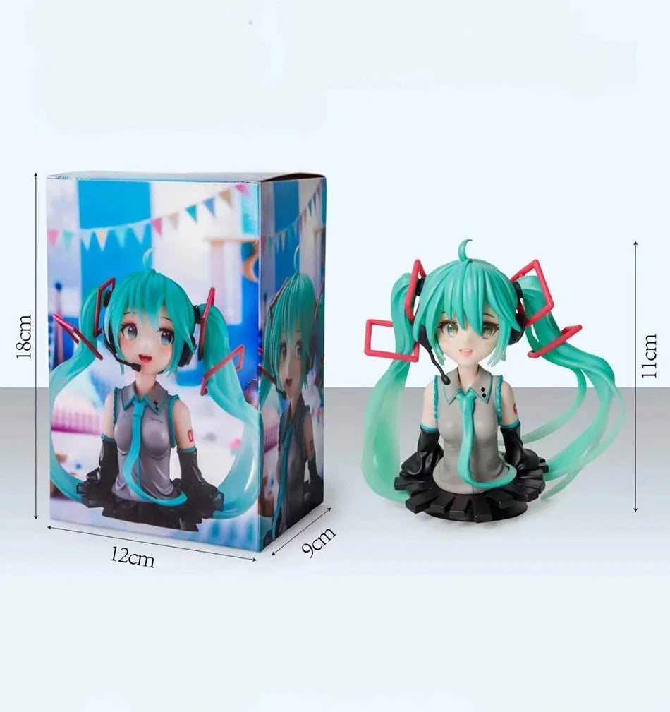 PVC figure of Hatsune Miku with teal hair and black outfit displayed in its box.
