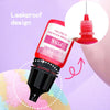 A pink liquid candle wax pigment bottle with a black applicator tip shown against a purple background.