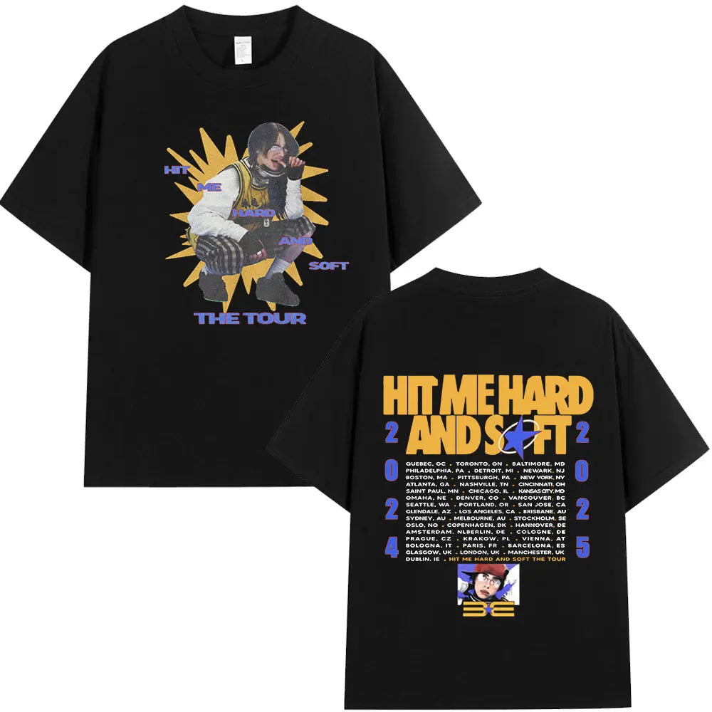 Black t-shirt featuring a graphic of a musician performing on a stage with the text HIT ME HARD AND SOFT THE TOUR