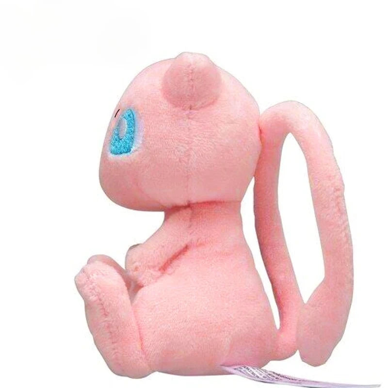 A soft pink Kawaii anime plush doll resembling a small rodent sitting down.