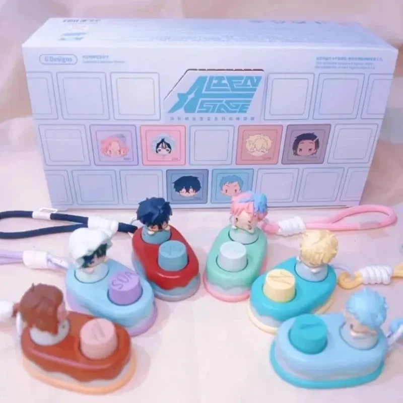 A collection of Alien Stage Baby Series collectible keycap blind boxes and related items displayed in front of a packaging bo
