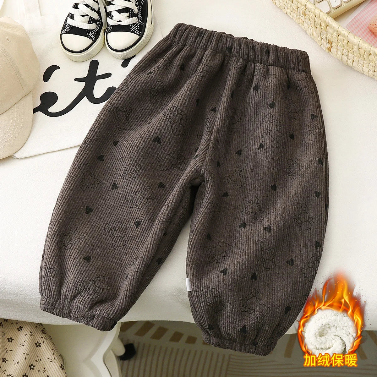 Dark gray corduroy toddler overalls featuring small heart embroidery