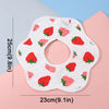 A white baby bib with red strawberry patterns is shown against a light background.