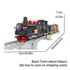 A black vintage steam passenger train model built from building blocks on a gray track.