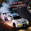 A white 4WD RC drift car with blue and red accents is shown driving on a track, emitting sparks and light.